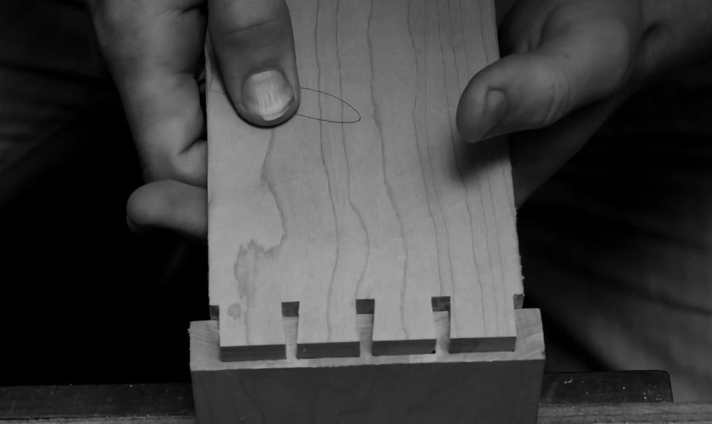 Hands fixing wooden planks together close up